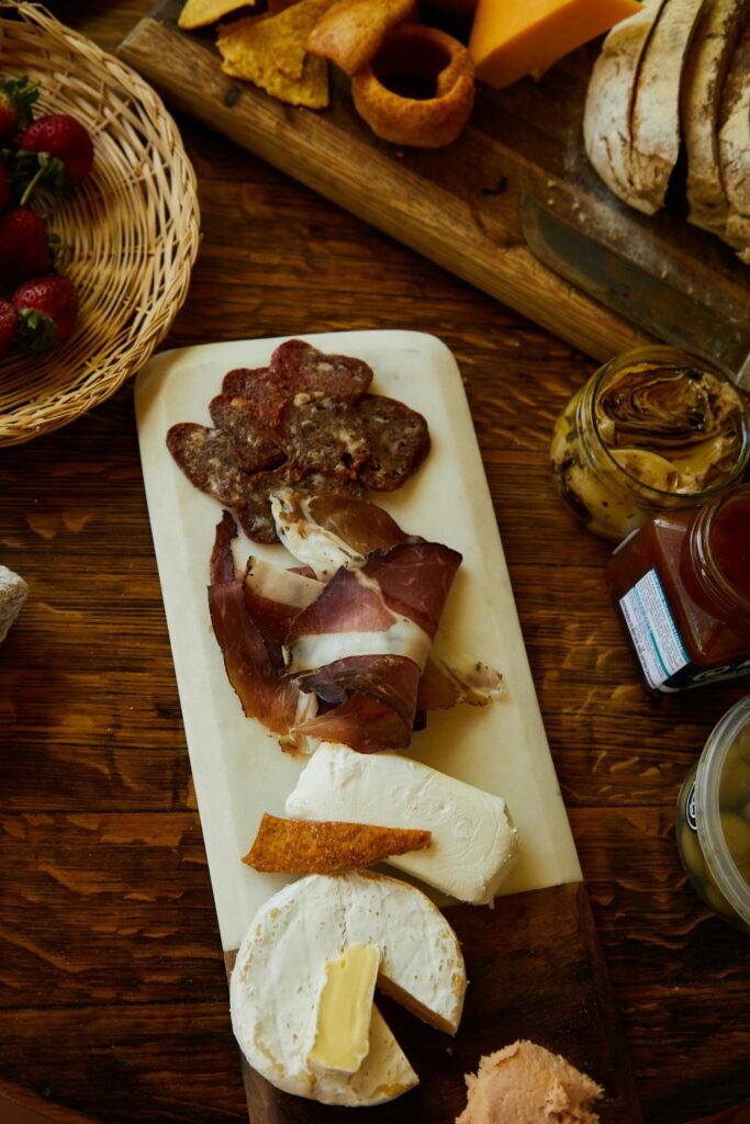 Delicious gourmet charcuterie board with a variety of cheeses and meats, perfect for a savory snack.